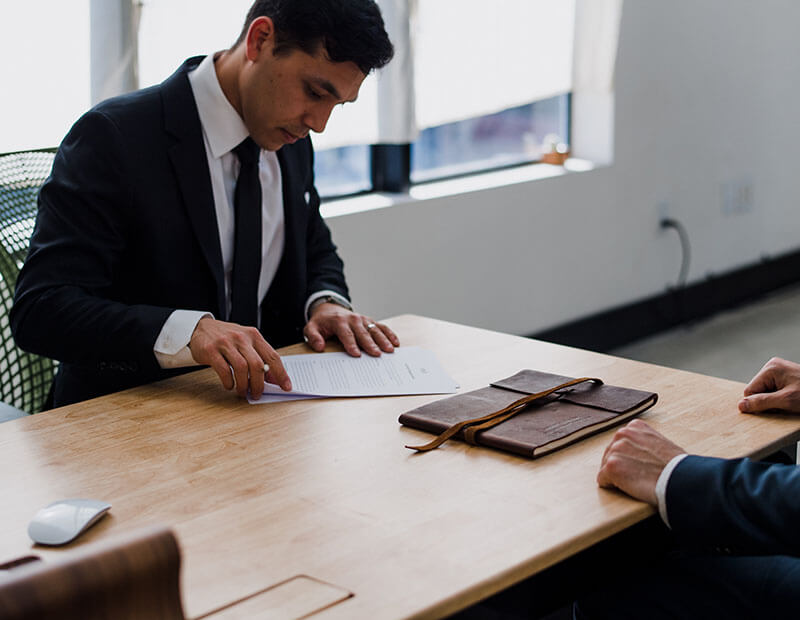 Man reviewing documents at table